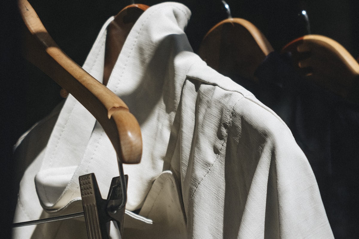 Crisp white shirt on hangers — premium laundry finish at AquaSpin